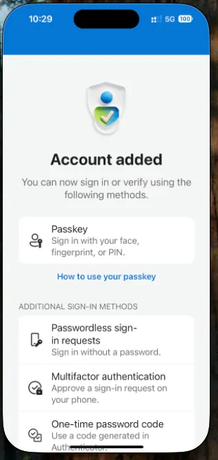 Microsoft Authenticator on iPhone confirming the account was added with a passkey and additional sign-in methods available